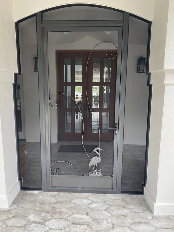 A custom-built, durable front entry enclosure built in Naples, Florida.